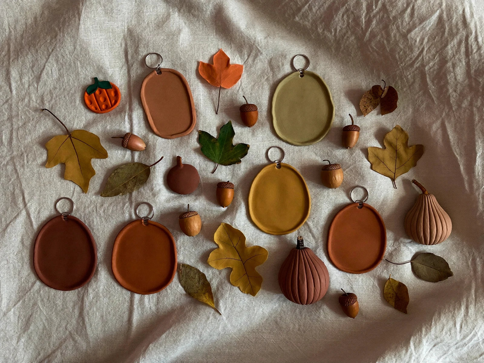 Autumn seasonal clay earring shapes with leaves.