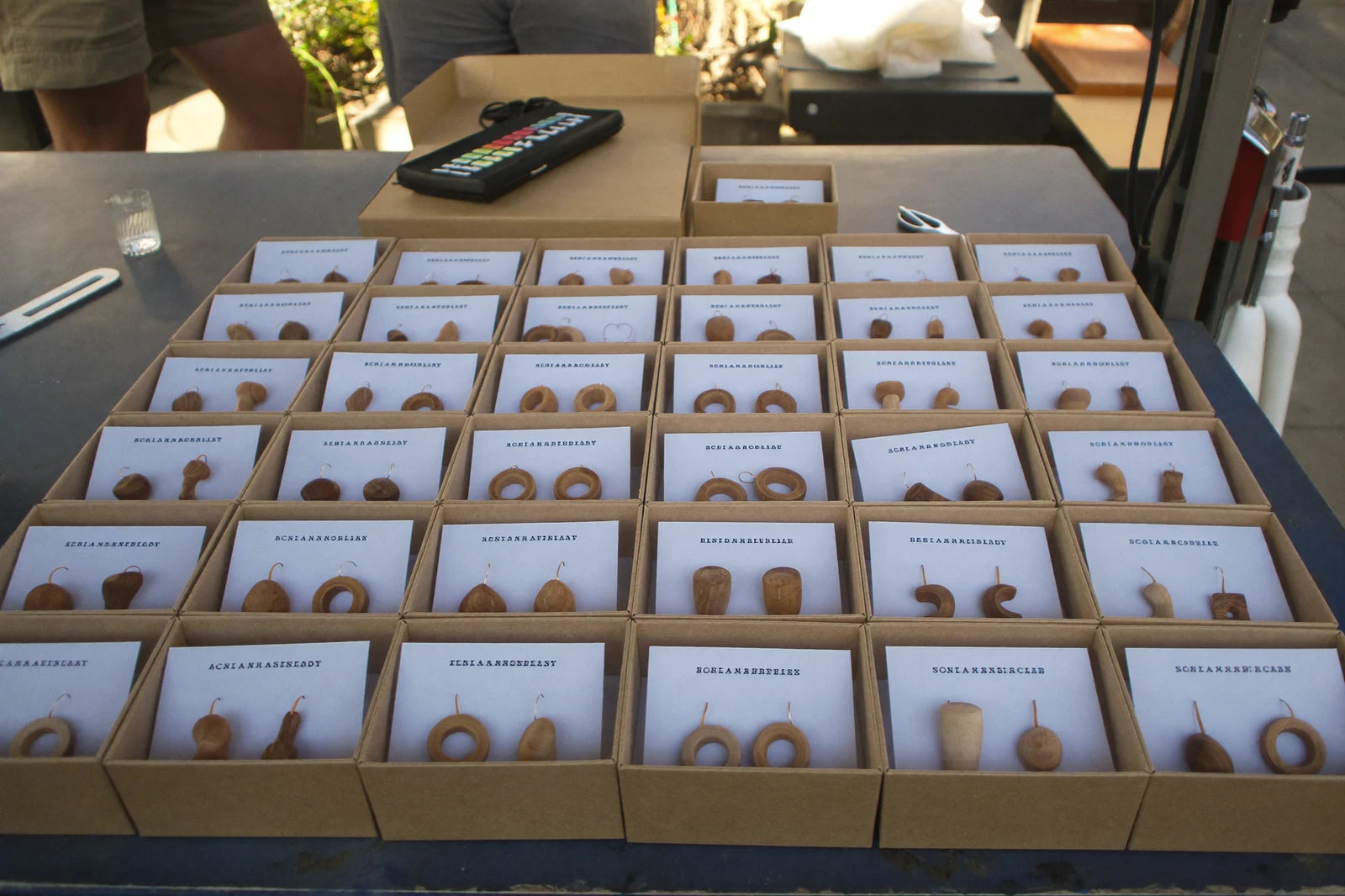 Finished laser-cut earrings packaged to sell.